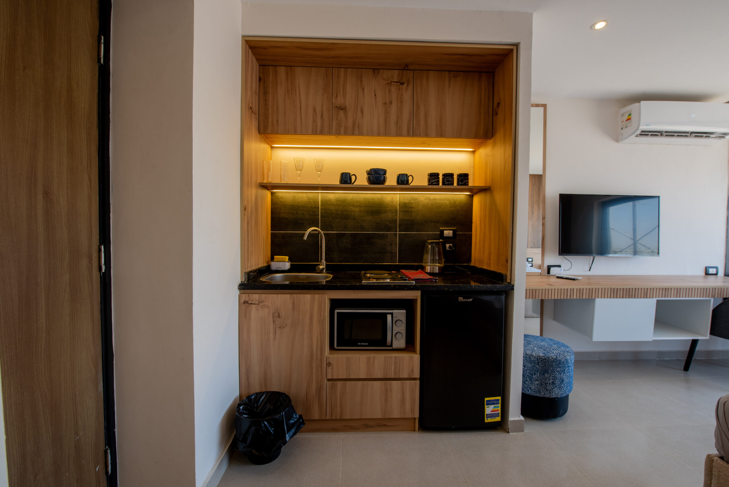 Minimalist interior with hidden storage and wood textures